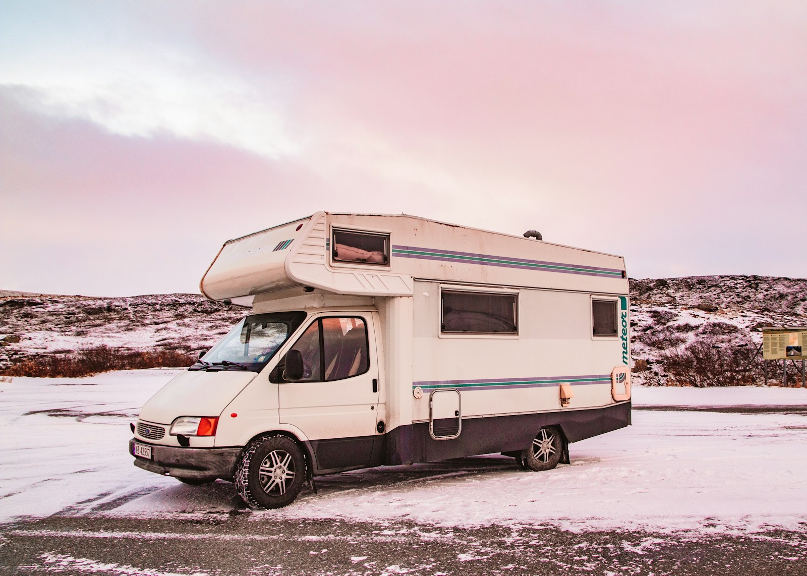 a white van parked in the snow